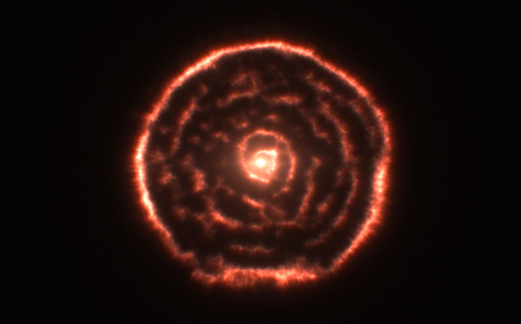 R Sculptoris is a nearby AGB variable star. This image, provided by ALMA, reveals a unique spiral structure. It is theorized that this structure is the result of a secondary shepherding the mass outflow of the AGB star.